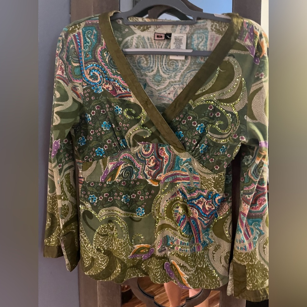 Fancy pattern and sparkled top! Size L but runs small. Figure flattering